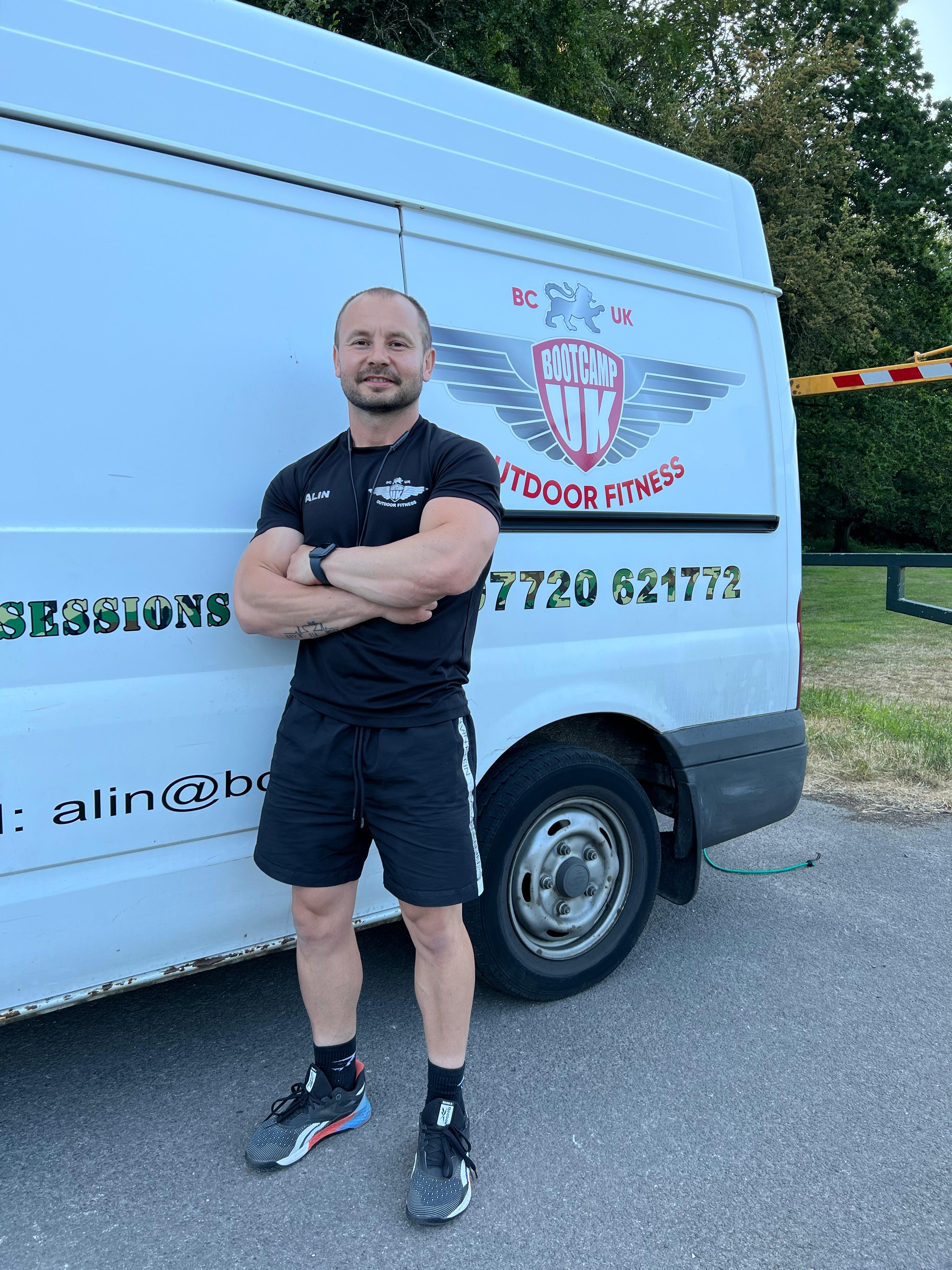 Alin in front of the Bootcamp UK outdoor fitness van