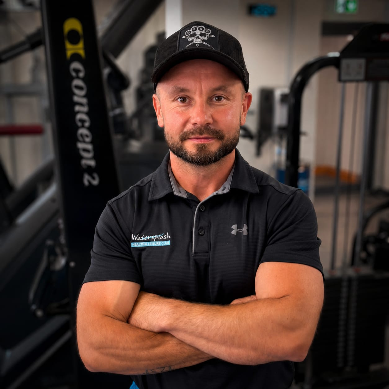 Personal trainer Alin Suciu standing in the gym