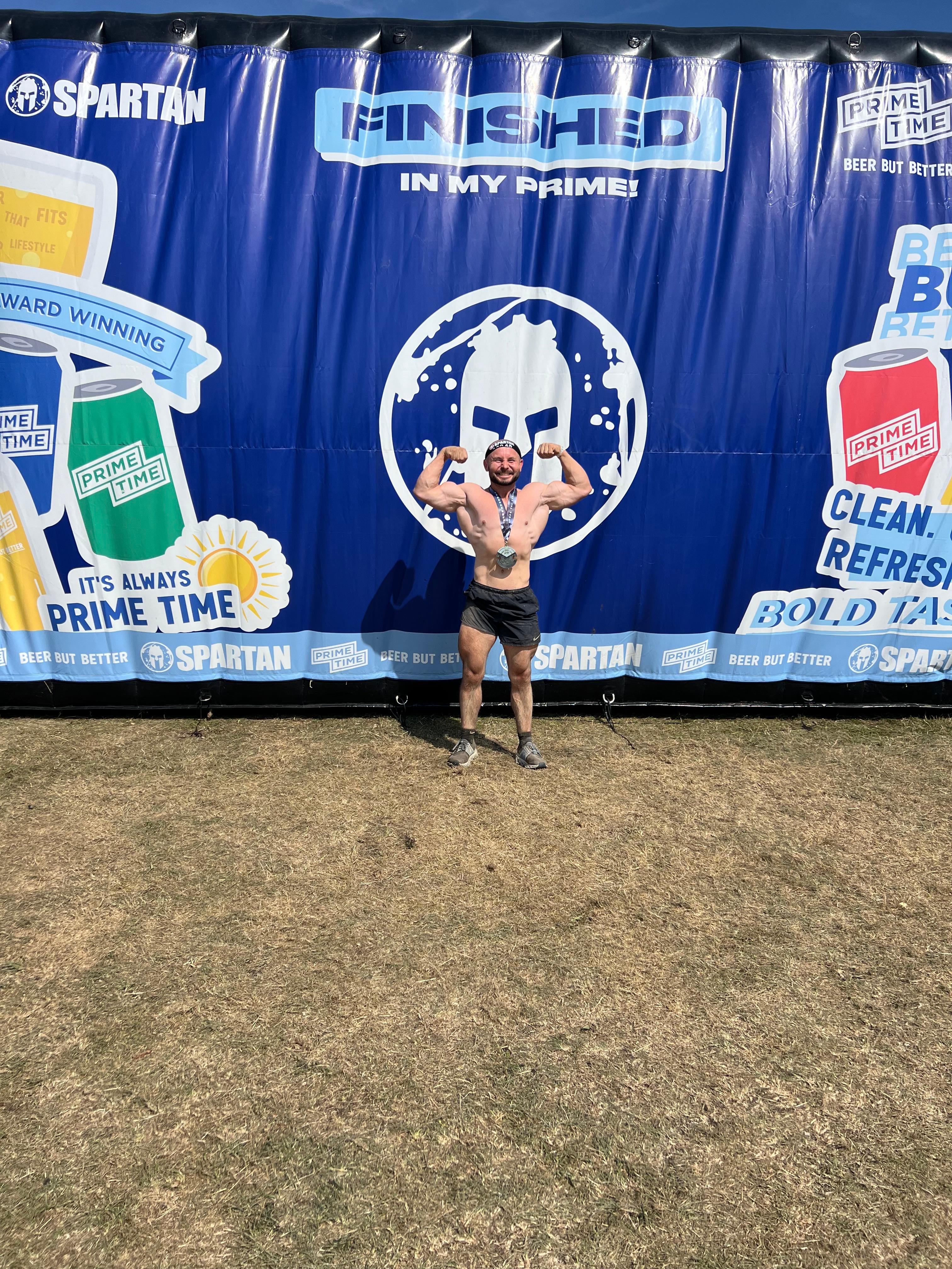 Alin Suciu celebrating after a Spartan fitness event